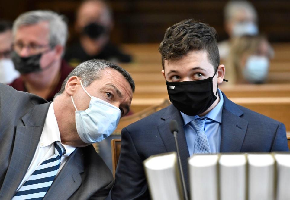 Kyle Rittenhouse, right, listens to his attorney, Mark Richards, during Rittenhouse's pretrial hearing Friday, May 21, 2021 at the Kenosha County Courthouse in Kenosha, Wis. Rittenhouse's attorneys and prosecutors are expected to iron out deadlines and other housekeeping matters ahead of his trial in November. Rittenhouse is charged with killing two men and wounding a third during the August protests.