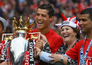 Cristiano Ronaldo of Manchester United celebrates winning the Barclays Premier League trophy with his mother, Dolores Aveiro after the Barclays Premier League match between Manchester United and Arsenal at Old Trafford on May 16, 2009 in Manchester, England. (Photo by Alex Livesey/Getty Images)