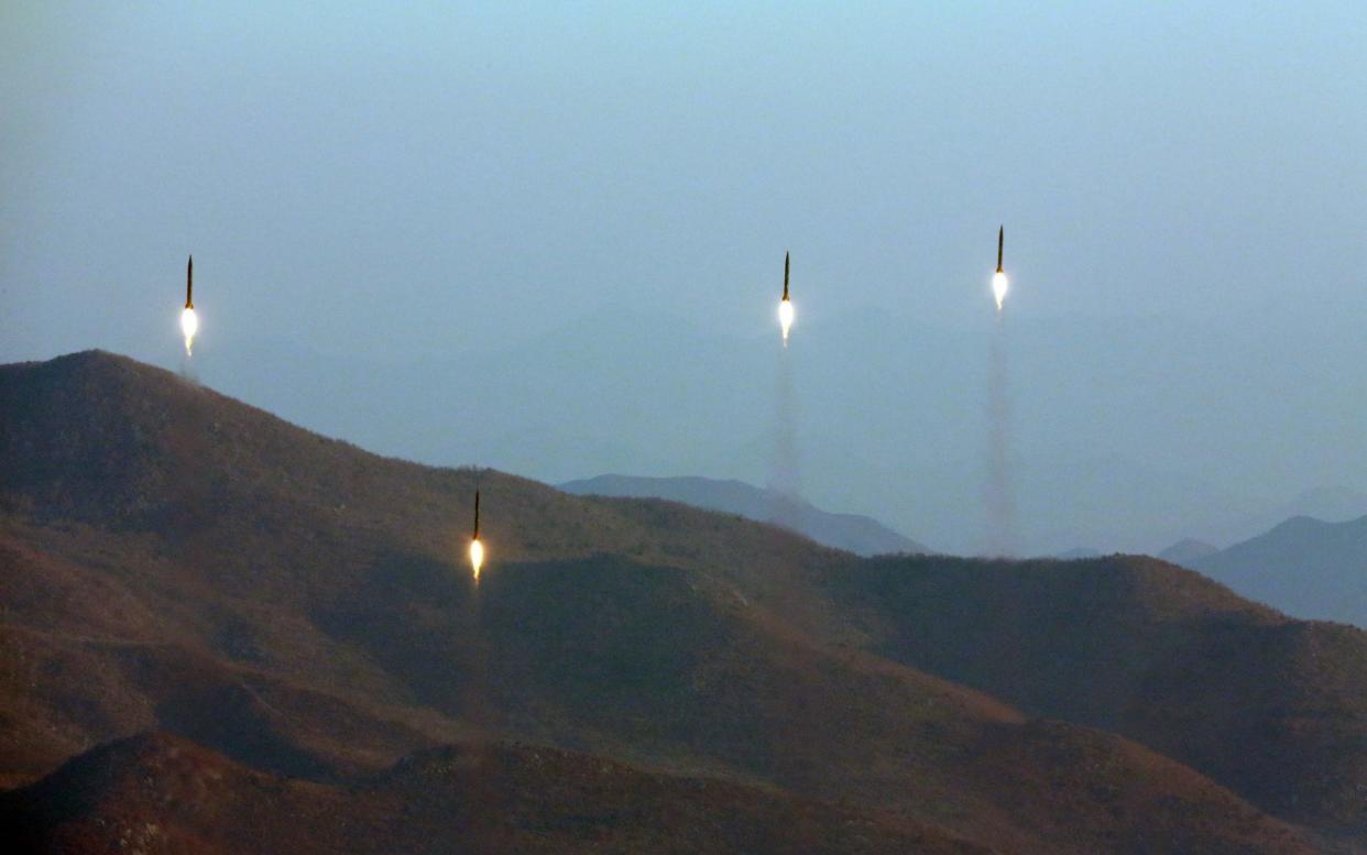 An undated file photo made available by the North Korean Central News Agency (KCNA), the state news agency of North Korea, on 07 March 2017, shows four projectiles during a ballistic rocket launching drill of Hwasong artillery units of the Strategic Force of the Korean People's Army (KPA) at an undisclosed location - KCNA