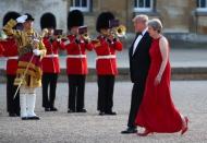 British Prime Minster Theresa May and U.S. President Donald Trump walk across the courtyard at Blenheim Palace, where they are attending a dinner with specially invited guests and business leaders, near Oxford, Britain, July 12, 2018. REUTERS/Hannah McKay