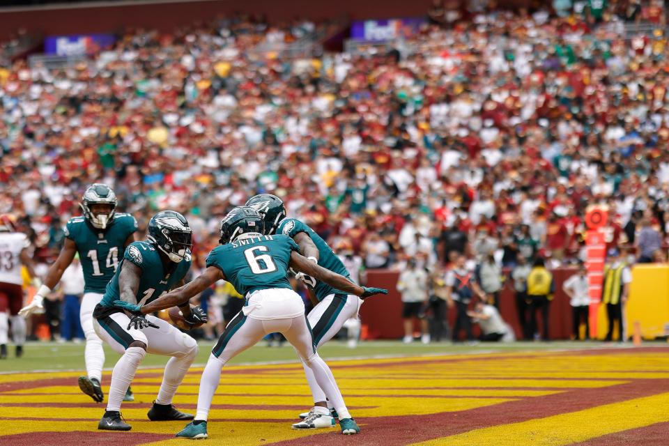 Philadelphia Eagles wide receiver A.J. Brown (11) celebrates with teammates after scoring a touchdown against the Washington Commanders during the second quarter at FedExField.