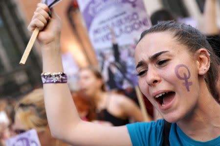 Protesters attend a demonstration against the release on bail of five men known as the "Wolf Pack" cleared of gang rape of a teenager and convicted of a lesser crime of sexual abuse in Madrid, Spain, June 22, 2018. REUTERS/Susana Vera