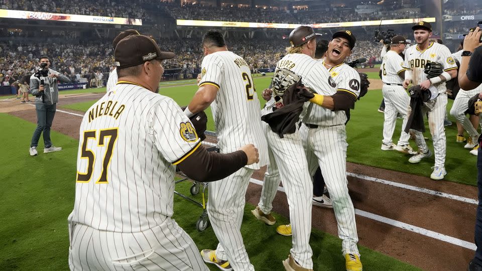 The San Diego Padres celebrate after the win over the Atlanta Braves. - Gregory Bull/AP