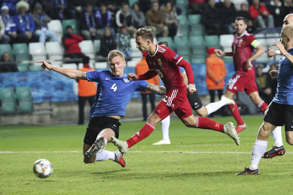 Hungary's Dominik Nagy, center, tries to score during the UEFA Nations League soccer match between Estonia and Hungary at the A. Le Coq Arena stadium in Tallinn, Estonia, Monday, Oct. 15, 2018. (AP Photo/Liis Treimann)