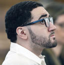 Emanuel Lopes looks up in court on day one of his trial for the 2018 murder of Weymouth Police Sgt. Michael Chesna and Vera Adams, in Norfolk Superior Court in Dedham, Mass., Thursday June 8, 2023. (Greg Derr/The Patriot Ledger via AP, Pool)