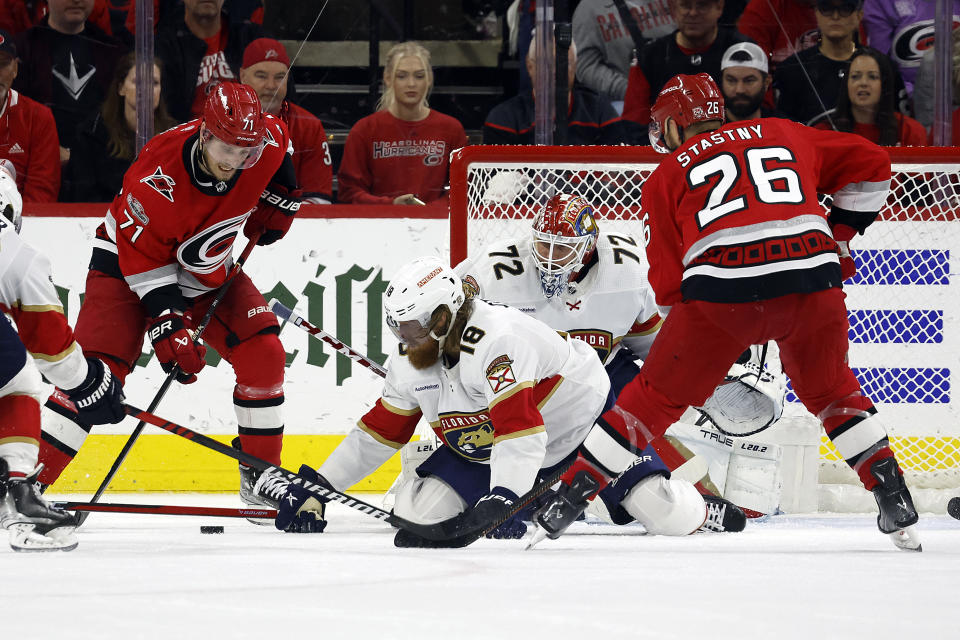 Carolina Hurricanes' Jesper Fast (71) tries to shoot the puck in front of Florida Panthers goaltender Sergei Bobrovsky (72) and Marc Staal (18) with Hurricanes' Paul Stastny (26) nearby during the third period of Game 2 of the NHL hockey Stanley Cup Eastern Conference finals in Raleigh, N.C., Saturday, May 20, 2023. (AP Photo/Karl B DeBlaker)