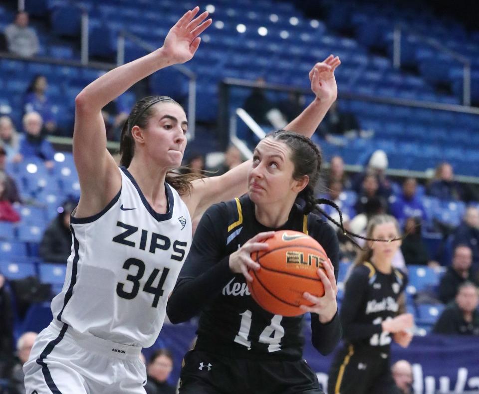 Akron's Reagan Bass defends Kent State's Katie Shumate in the second half at Rhodes Arena, Saturday, Jan. 20, 2024.