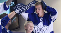 <p>Pop sensation Justin Bieber hams it up during Game 6 between the Capitals and Maple Leafs in Toronto. (Frank Gunn/CP) </p>