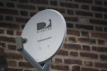 A Direct TV dish is seen outside a home in the Queens borough of New York July 29, 2013. REUTERS/Shannon Stapleton