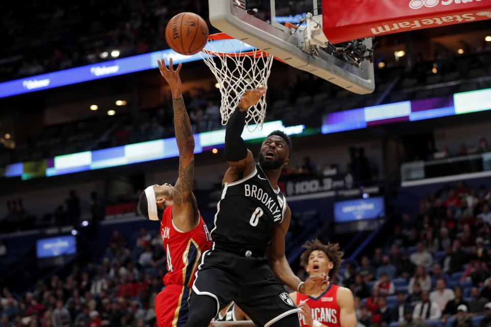 New Orleans Pelicans forward Derrick Favors (22) goes to the basket against Brooklyn Nets guard David Nwaba (0) in the first half of an NBA basketball game in New Orleans, Tuesday, Dec. 17, 2019. (AP Photo/Gerald Herbert)