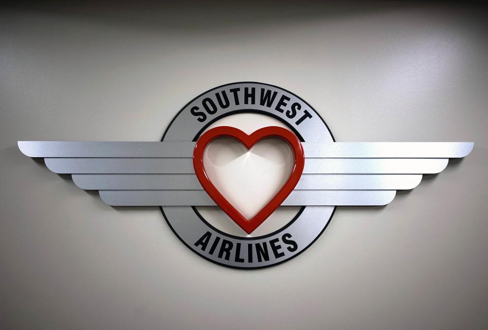 A sign hangs in the Southwest Airlines offices at Denver International Airport in Denver