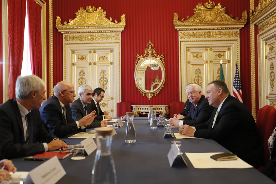 US Secretary of State Mike Pompeo, right, talks with Portuguese Foreign Minister Augusto Santos Silva, 2nd left during a meeting at the Foreign Ministry in Lisbon Thursday, Dec. 5, 2019. (AP Photo/Armando Franca)