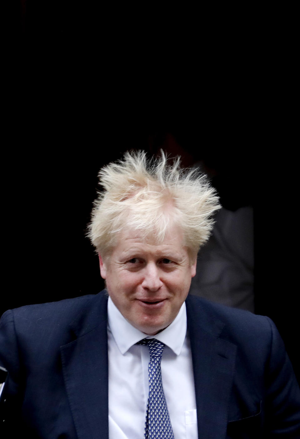 Britain's Prime Boris Johnson leaves 10 Downing Street to attend the weekly Prime Ministers' Questions session, in parliament in London, Wednesday, Oct. 23, 2019. (AP Photo/Frank Augstein)