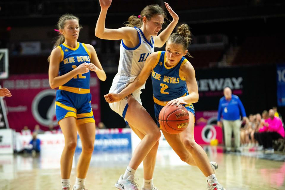 Martensdale St. Marys' Brynnly German (2) drives past her defender Claire Schroeder during the 2024 1A quarterfinal Wednesday, Feb. 28, 2024, at Wells Fargo Arena.