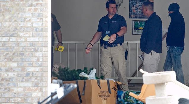 Authorities investigate a crime scene at a house in Pleasant Grove, Utah. Photo: AP.