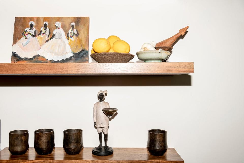 Kitchen items and art on open shelving