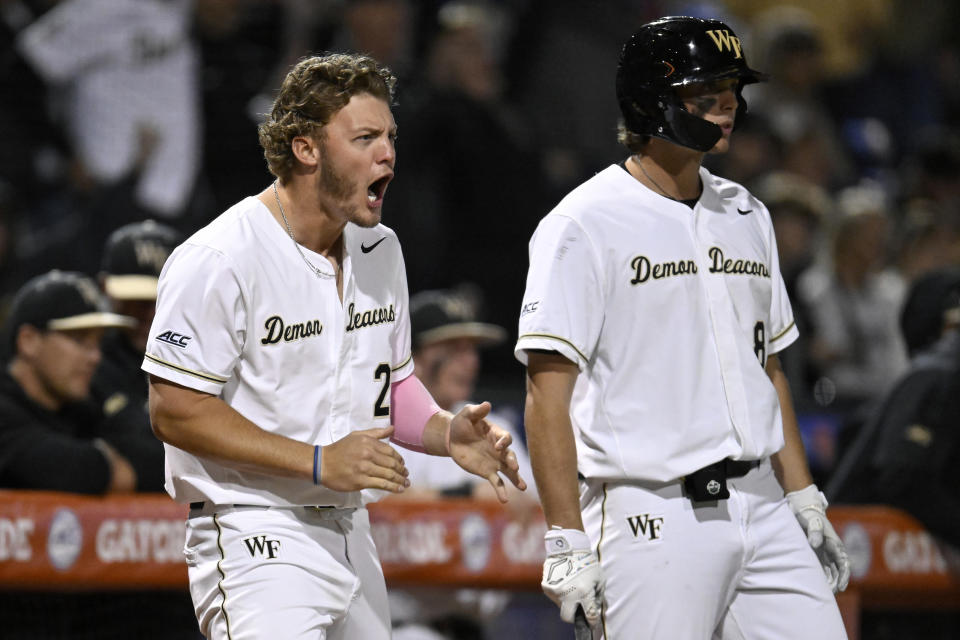 DURHAM, NORTH CAROLINA - MAY 26: Brock Wilken #25 and Nick Kurtz #8 of the Wake Forest Demon Deacons celebrate a run against the Notre Dame Fighting Irish in the fifth inning during the ACC Baseball Championship at Durham Bulls Athletic Park on May 26, 2023 in Durham, North Carolina. (Photo by Eakin Howard/Getty Images)