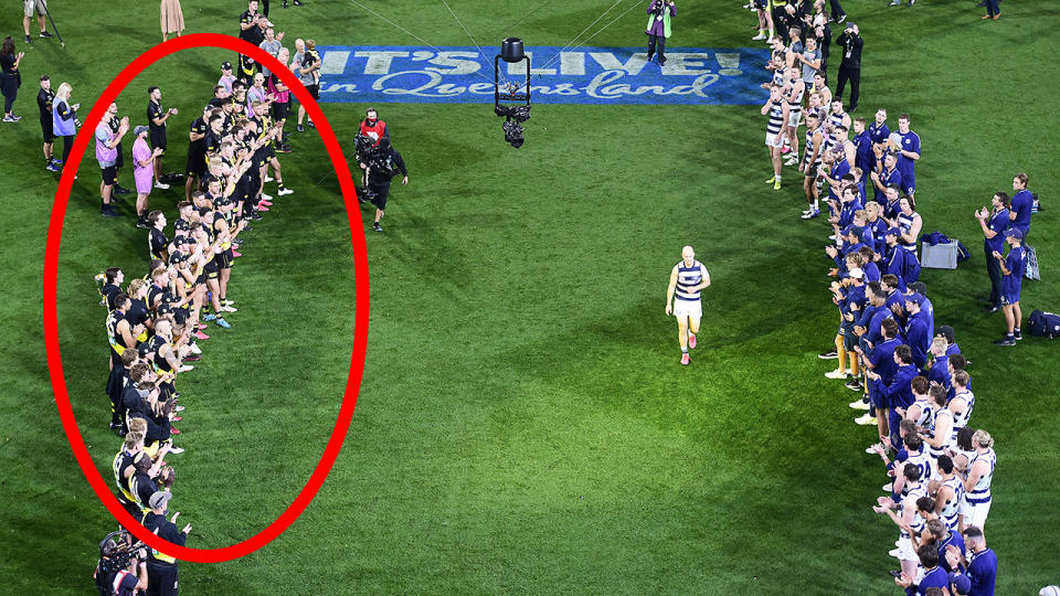 The Richmond Tigers and Geelong Cats are pictured giving retiring AFL player Gary Ablett Jr a guard of honour.
