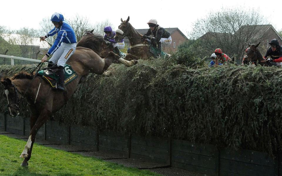 Sam Twiston-Davies jumps Beechers Brook during the John Smiths Topham steeple chase on the second day of the Grand National meeting at Aintree - Reuters