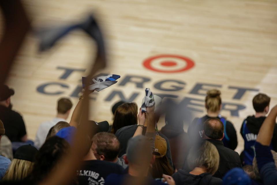 Minnesota Timberwolves fans wave towels during Game 3 of an NBA basketball first-round playoff series against the Memphis Grizzlies Thursday, April 21, 2022, in Minneapolis. (AP Photo/Andy Clayton-King) ORG XMIT: MNAK218