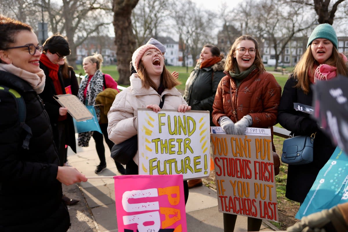 Teachers from the National Education Union display placards on a picket line in London  during industrial action on March  2  (REUTERS)