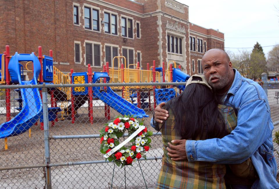 Ayanna Patterson is embraced by her father, Frank Jackson, during a ceremony to mark the ninth anniversary of her daughter's 2002 disappearance.