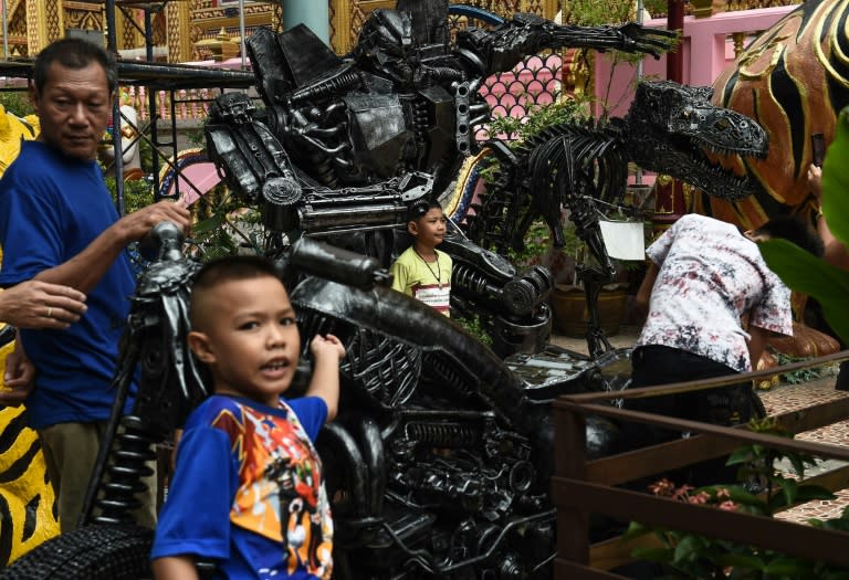 At least four Buddhist temples across Thailand and a meditation centre have bought superhero statues, according to Pairoj Thanomwong, the Thai artist who runs the workshop where the sci-fi monsters and comic book figures are manufactured