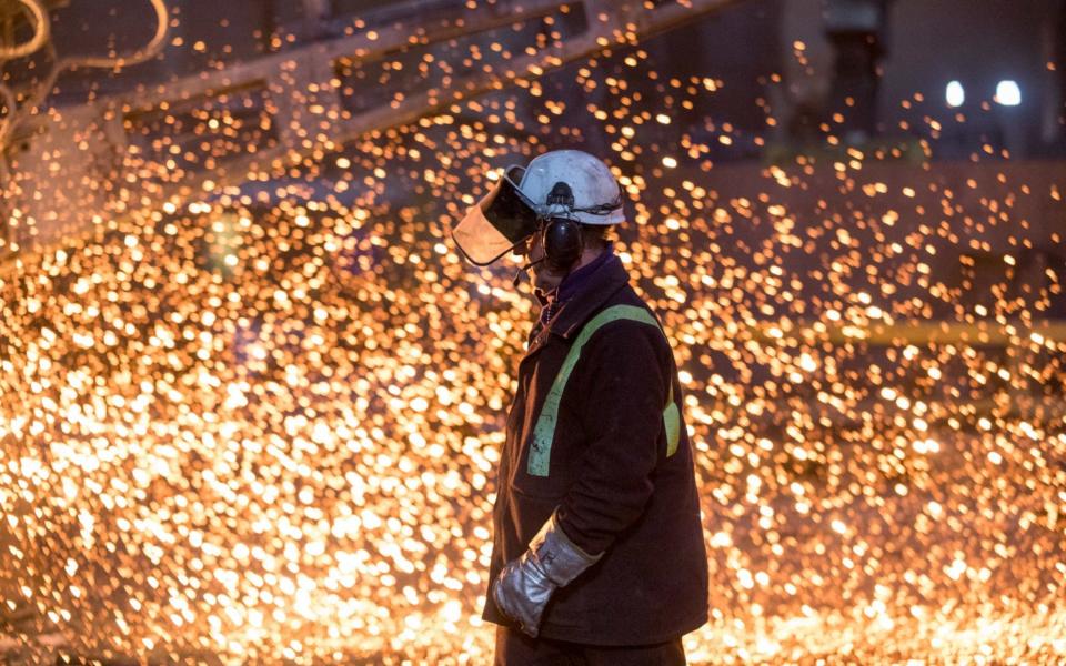 An employee passes the electric arc furnace at Liberty Steel's Aldewerke mill in Rotherham - Chris Ratcliffe/Bloomberg