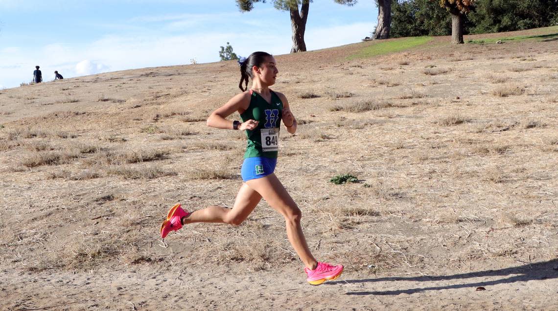 Highland High senior Mía Torrecillas won her third section title after claiming the Division II race in 18:10.42 at the CIF Central Section cross country championships at Woodward Park on Nov. 16, 2023.