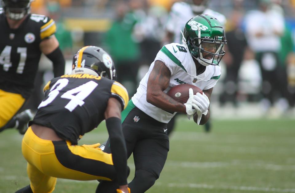 Elijah Moore of the New York Jets looks to get around Terrell Edmunds of the Steelers during the first half in Pittsburgh, Oct. 2, 2022.