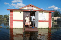 Pastor Louicesse Dorsaint stands with his wife Maria Dorsaint in front of their church, Haitian United Evangelical Mission, which was damaged by flooding from Hurricane Irma in Immokalee, Florida, U.S. September 12, 2017 REUTERS/Stephen Yang