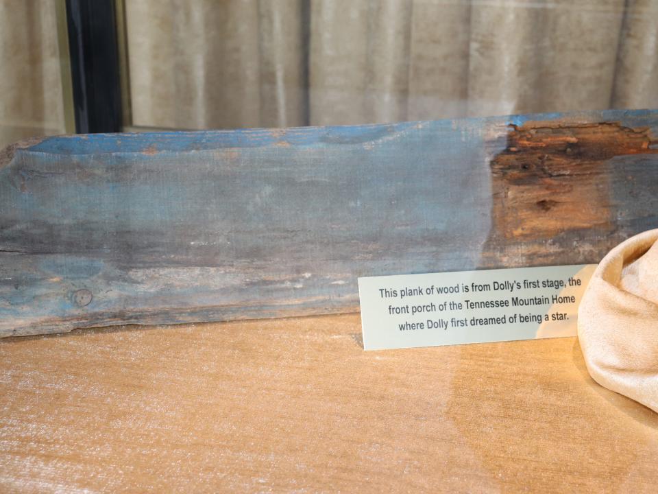 A piece of wood from Dolly Parton's childhood home on display at Dollywood.