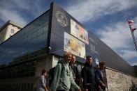 FILE PHOTO: People walk in front of the Polish Central Bank (NBP) building in Warsaw