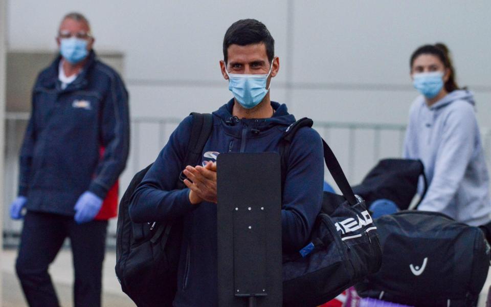 Serbian tennis player Novak Djokovic arrives before heading straight to quarantine for two weeks isolation ahead of their Australian Open warm up matches in Adelaide - AFP