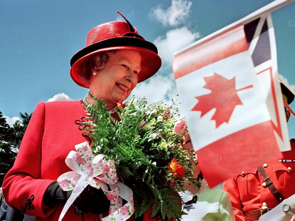 Queen Elizabeth II smiles as she visits Bowring Park in St. John's, Newfoundland, on June 25, 1997.