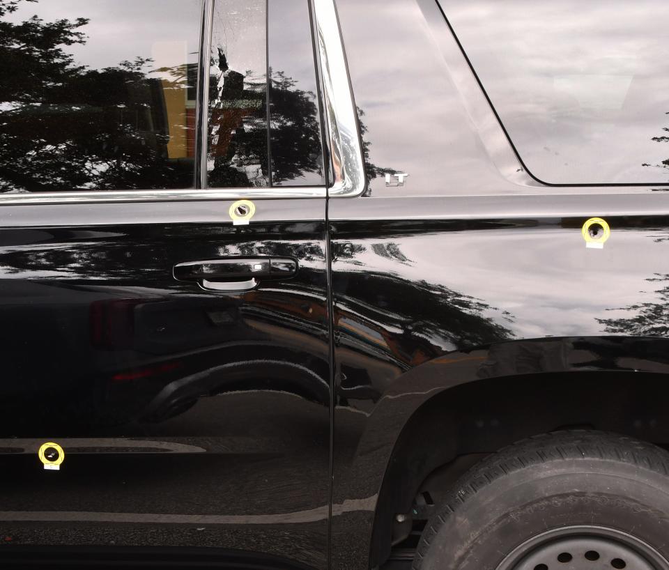 Bullet holes riddle a Chevrolet Suburban after a Saturday early-morning shooting in downtown Melbourne.