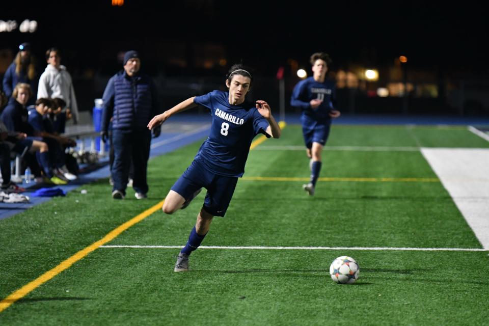 Camarillo's Adam Youngs runs down the ball during the Scorpions' 4-0 win over Royal in a Coastal Canyon League match Monday night.