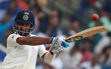 Cricket - India v Australia - Third Test cricket match - Jharkhand State Cricket Association Stadium, Ranchi, India - 19/03/17 - India's Cheteshwar Pujara plays a shot. REUTERS/Adnan Abidi