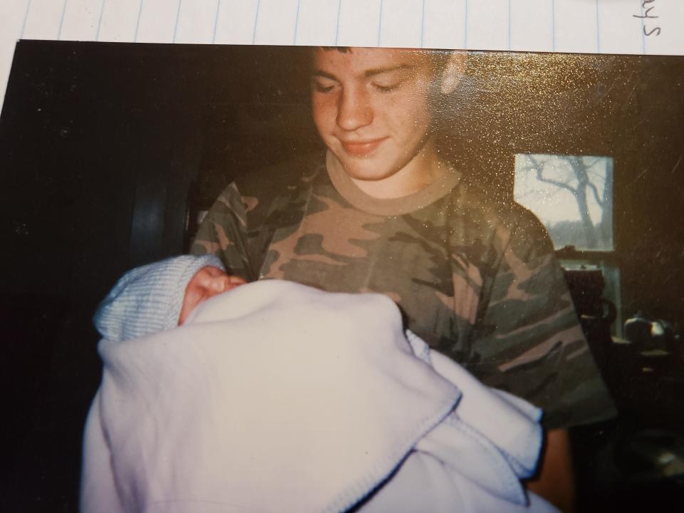 Ronnie Peale Jr. holding his nephew 