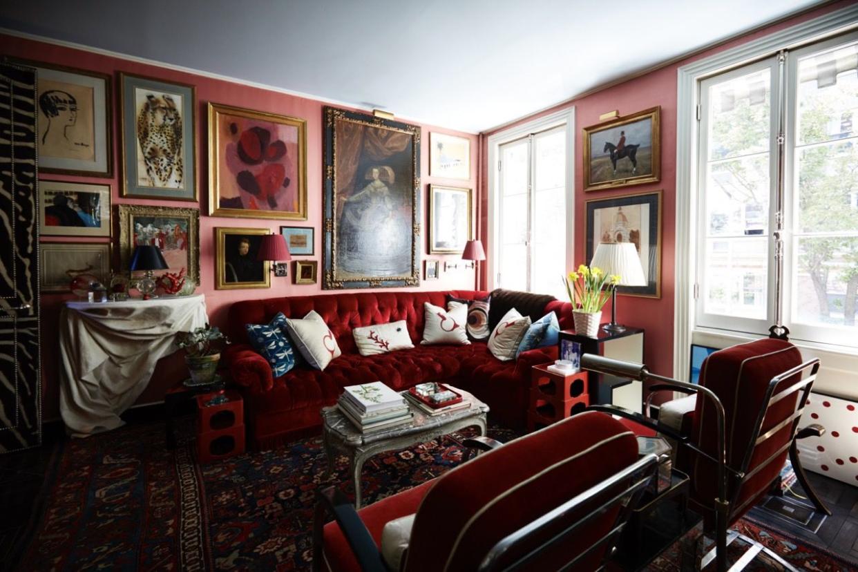 a living room with a red couch