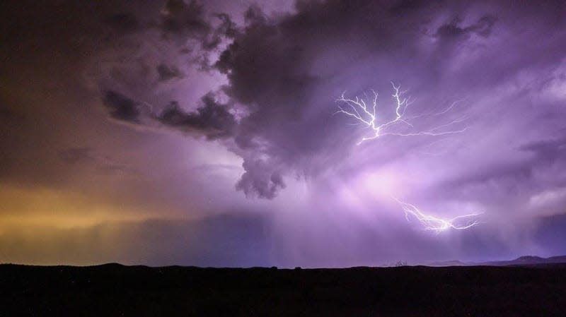 Lightning strikes during a monsoon storm on July 21, 2022 near Mayer, Arizona. Skies across the U.S. may look similarly in mid June 2023. 