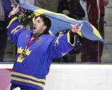 FILE - Sweden's goalie Henrik Lundqvist celebrates after beating Finland 3-2 to win the gold medal in the 2006 Winter Olympics men's ice hockey gold medal game in Turin, Italy, Feb. 26, 2006. Henrik Lundqvist is expected to be elected to the Hockey Hall of Fame in his first year of eligibility. (AP Photo/Gene J. Puskar, File)