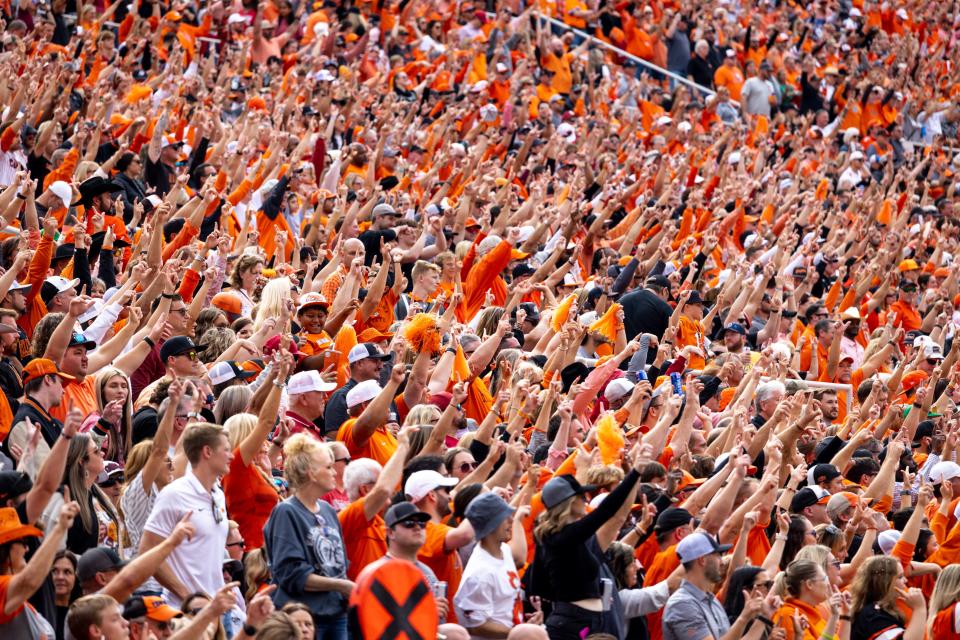 Fans cheer during a Bedlam college football game between the Oklahoma State University Cowboys (OSU) and the University of Oklahoma Sooners (OU) at Boone Pickens Stadium in Stillwater, Okla., Saturday, Nov. 4, 2023.