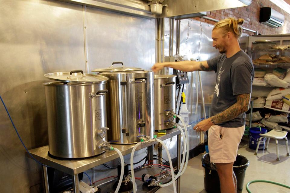 Elliot Seidler works on finishing touches on the Civic Brewing Co. in Sopchoppy.