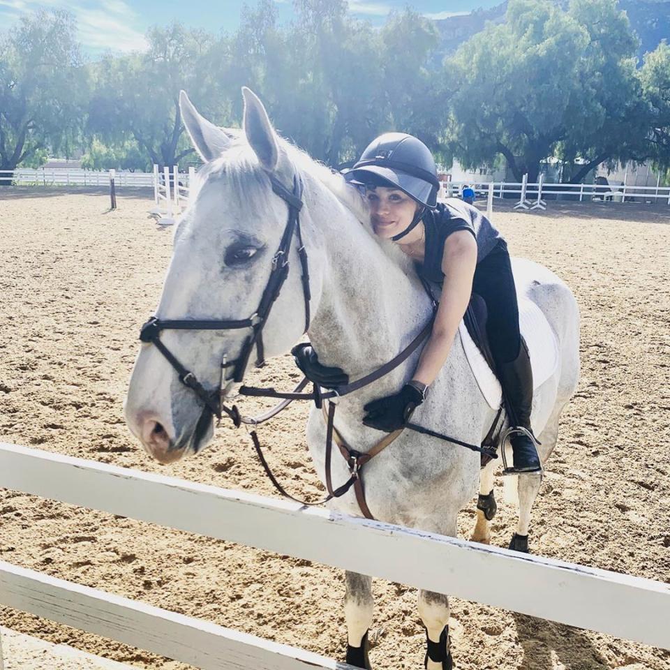 Kaley Cuoco on a white horse