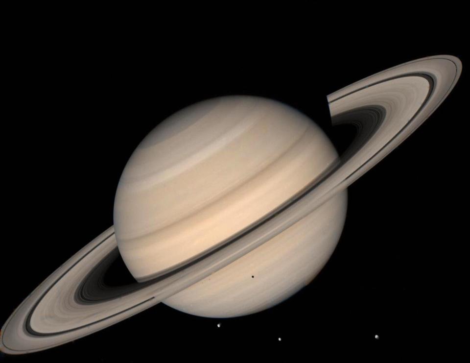 Cassini's voyage to Saturn has returned data showing some of its moons could support life - Credit: AFP