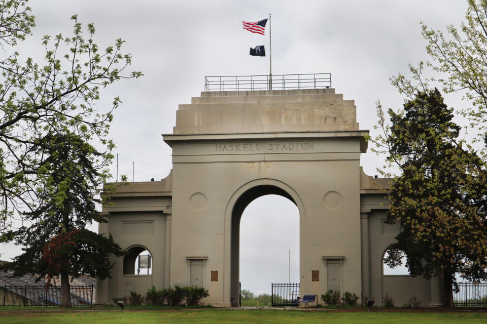 The stadium entrance at Haskell Indian Nations University stands against a cloudy sky in April 2024.