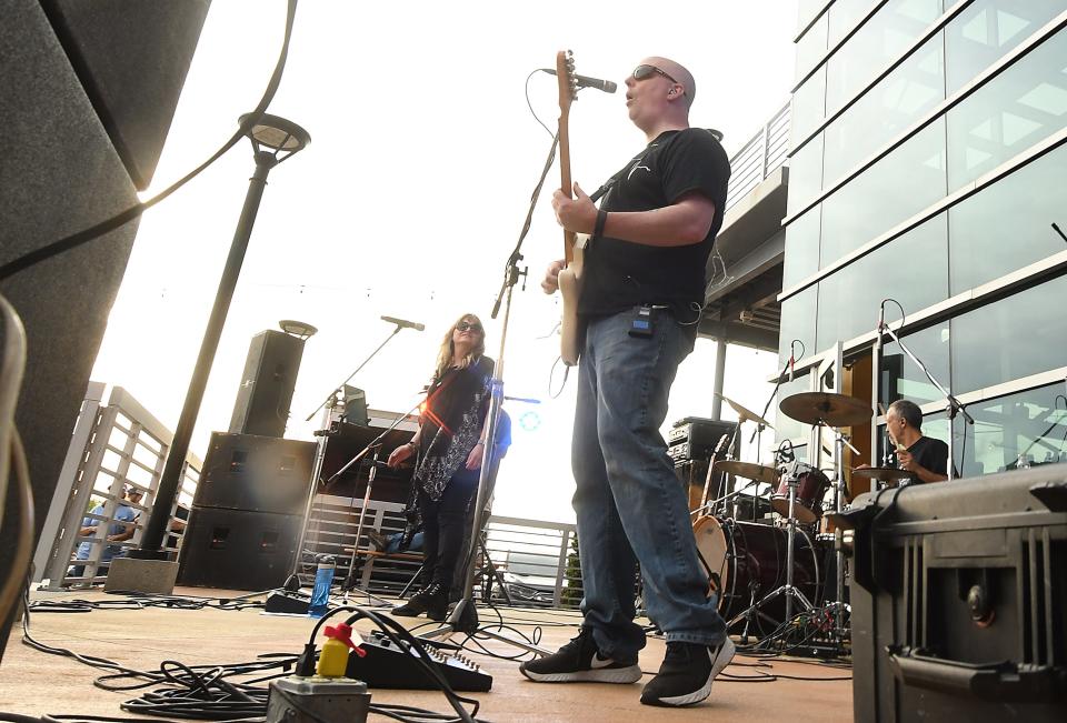 Machine Gun performs Saturday April 16, 2022 at the Boatyard at Marina Grill to kick off The Marina Grill's Saturday Sunset music series The series will continue most Friday evenings into the fall from 6-9 p.m. Saturdays and is free.  [KEN BLEVINS/STARNEWS]