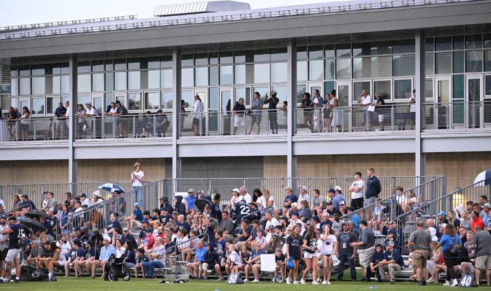 Fans sat through the rain to watch Penn State’s open football practice at the Lasch practice field Saturday, Aug. 12, 2023.