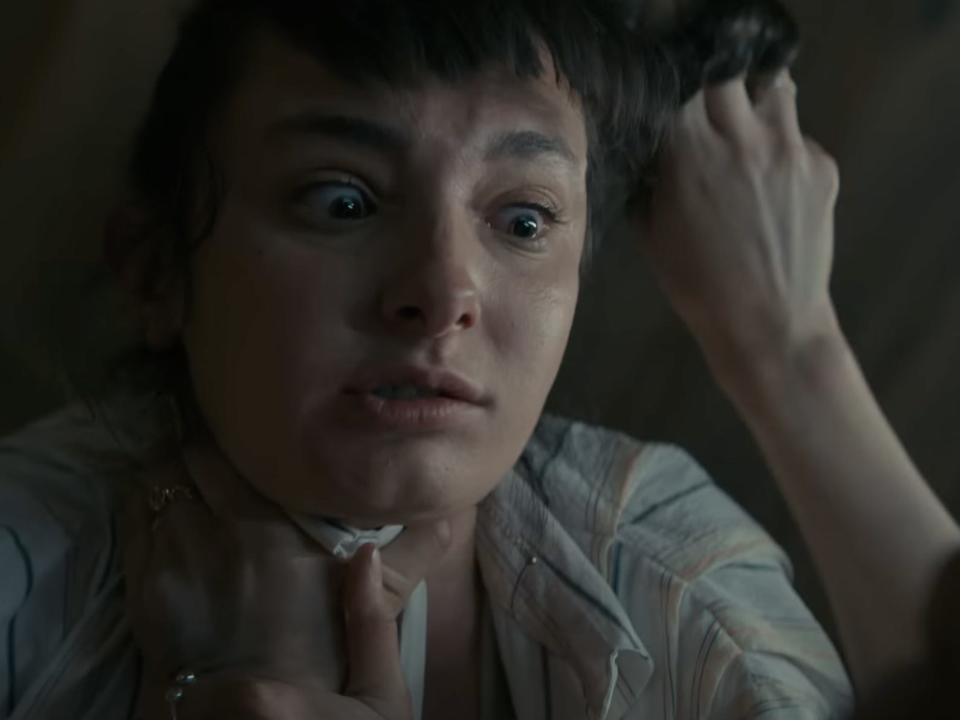 Mia Challis as Jessica getting strangled by a deadite.